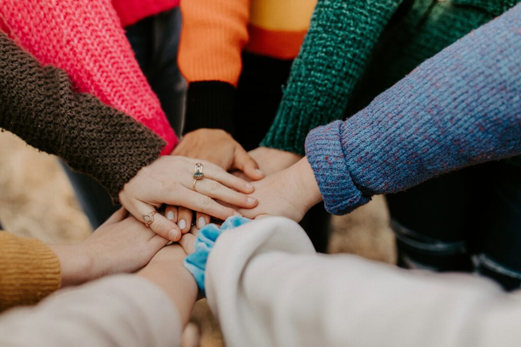 People putting their hands together